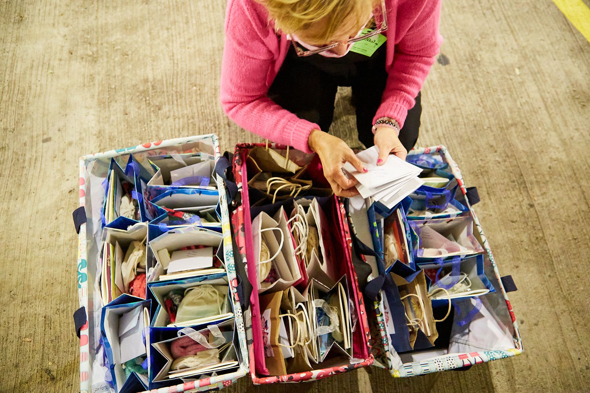 Birds Eye View Jennifer Putting Notes into Bags